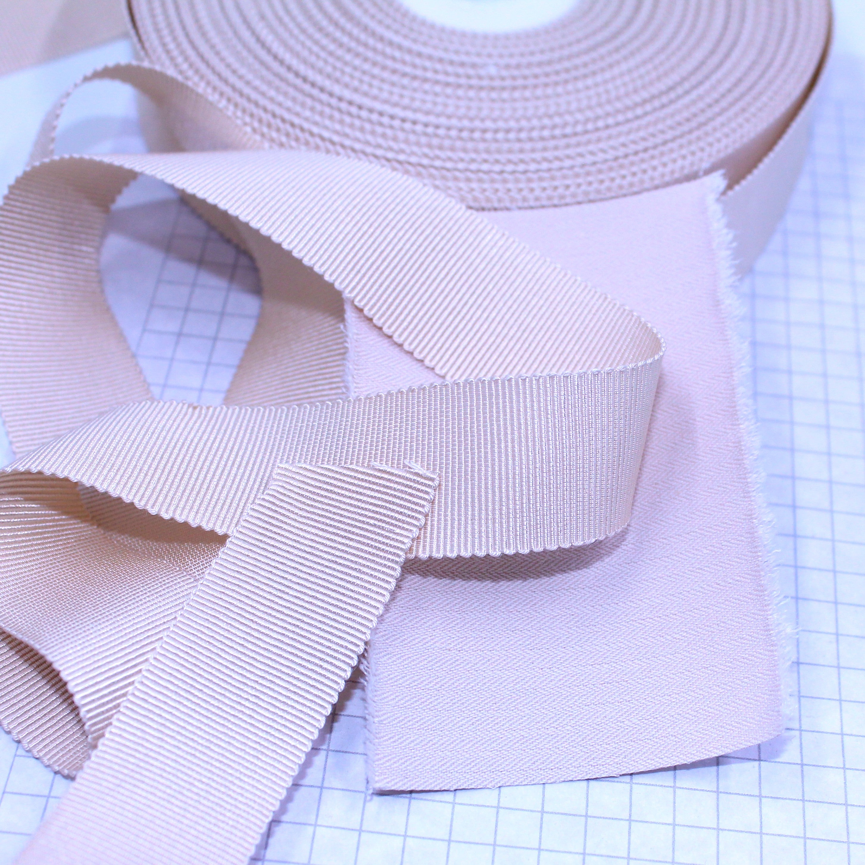 Beige Petersham ribbon, 24mm wide (1") with beige coutil. Co-ordinates but does not match. Petersham is a great corset binding
